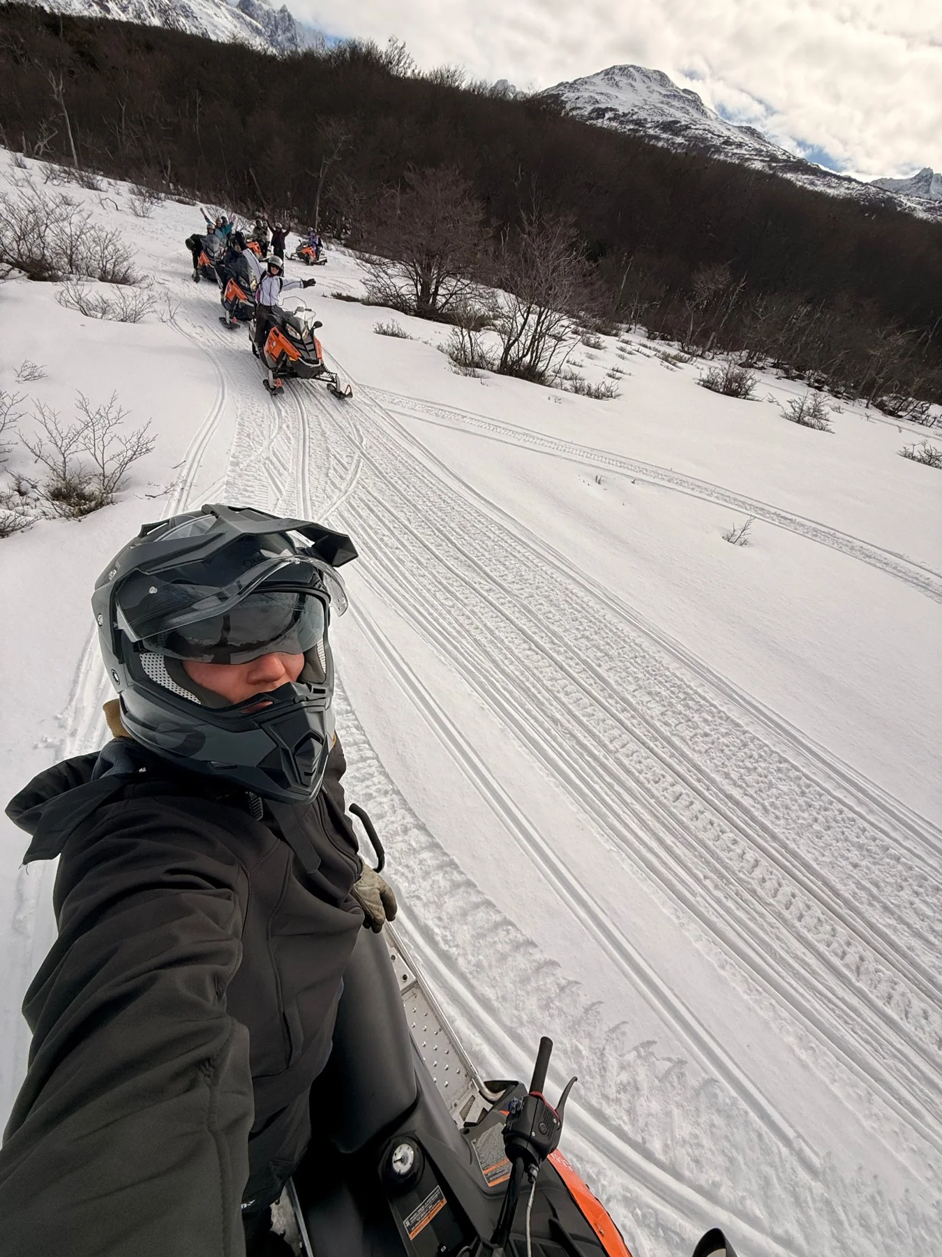 Snowmobile tour group on a winter route