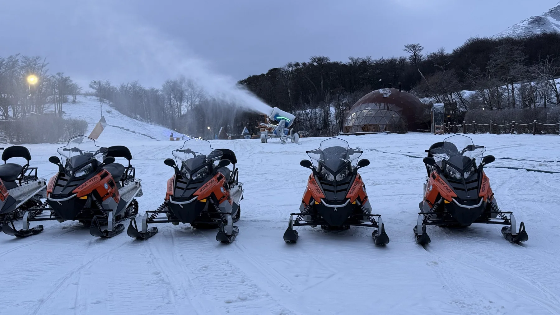 Snowmobile fleet staged in the snow